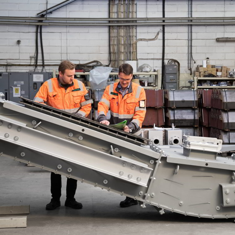 project managers checking conveyors