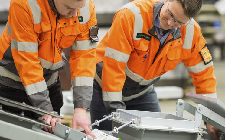 Project Managers checking conveyor